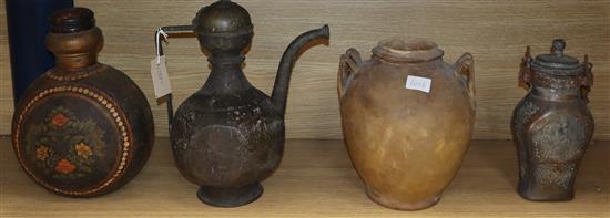 An Indo-Persian brass ewer, a parchment jar, painted metal flask and a tinned metal flask